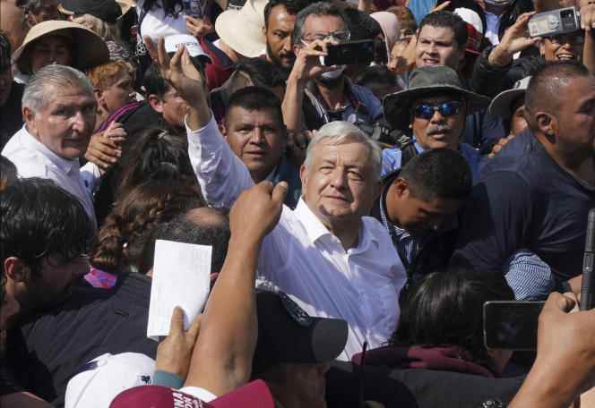 Mexican President Andrés Manuel Lopez Obrador pushes through the crowd to reach the Zocalo Square in Mexico City.  November 27.
