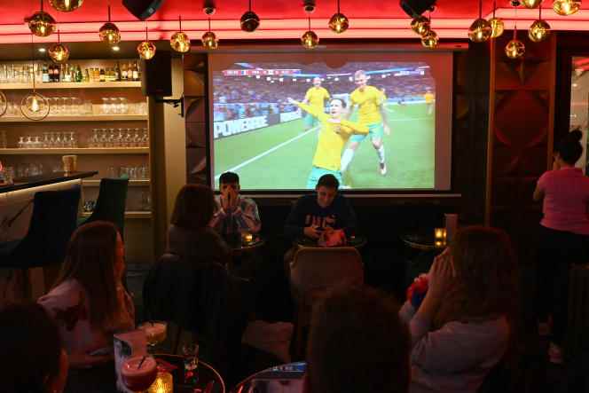 French supporters follow the first match of the Blues in the World Cup in Qatar, against Australia, at the DogStar Club, in the Champs-Elysées district, in Paris, on November 22, 2022.