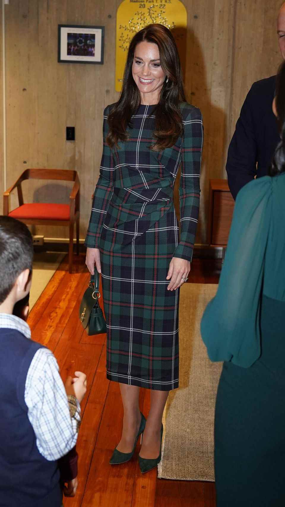 Catherine, Princess of Wales, arrives in a plaid dress at Boston City Hall. 