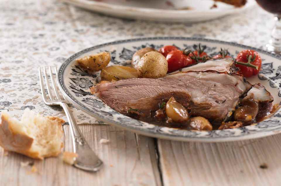 Cut and serve the roast lamb for Easter