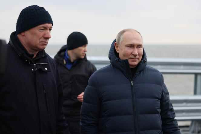 Russian President Vladimir Putin (right), alongside Deputy Prime Minister Marat Khousnullin, visits the Crimean Bridge, December 5, 2022.