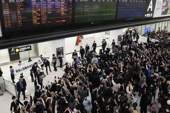 The Japanese players were greeted on their return home by thousands of supporters at Narita International Airport in Tokyo.