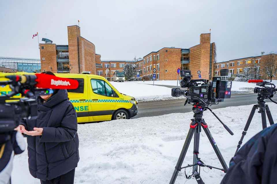 Reporters gather in front of Oslo University Hospital.