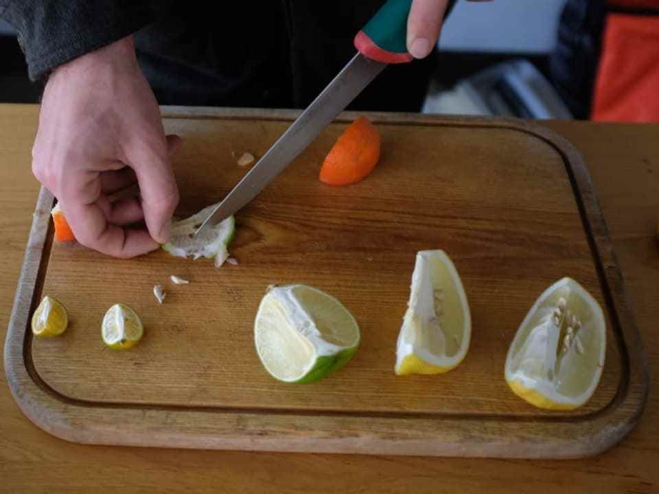Various citrus fruits on a board 