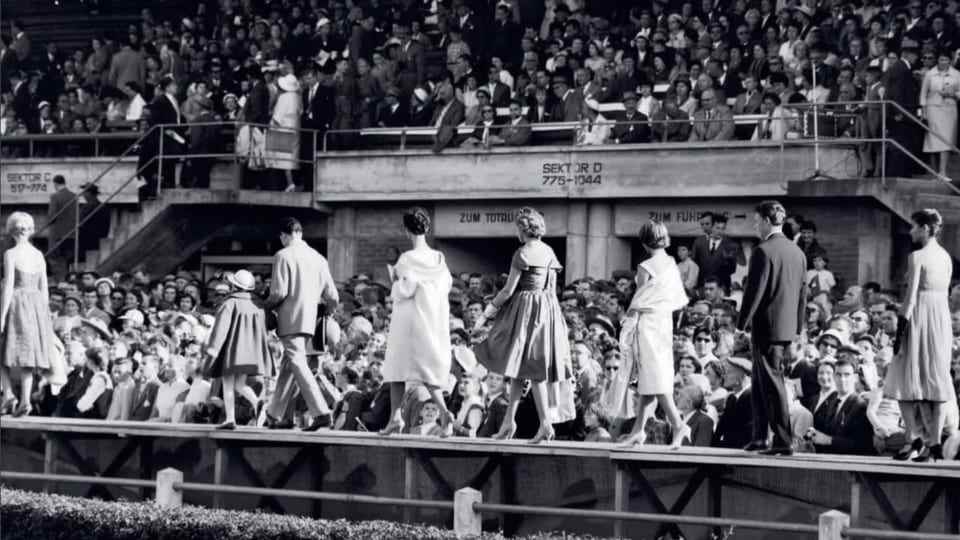 Models on the catwalk in front of the grandstand