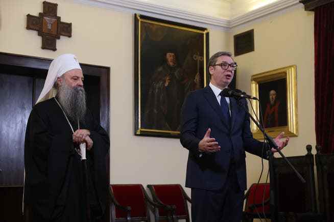 Serbian President Aleksandar Vucic (right) and Patriarch Porfirije during Tuesday's press conference in Belgrade.