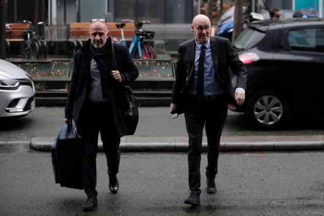 The president of the French Rugby Federation, Bernard Laporte (right), arrives at the sports ministry, in Paris, on December 22, 2022. 