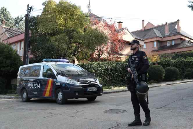 In Madrid, a police officer stands outside the Ukrainian embassy after receiving a bloodied package on Friday, December 2, 2022, following several letter bombs received earlier. 