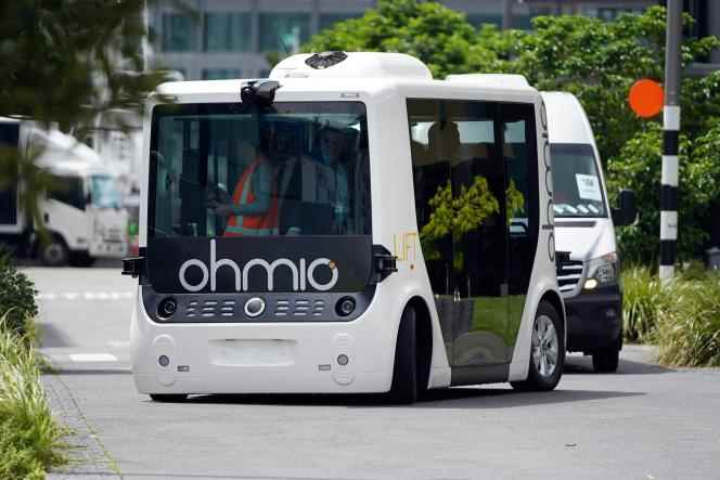 Finnish Prime Minister Sanna Marin rides in a bus during a presentation of autonomous vehicles in Auckland, New Zealand, November 30, 2022.