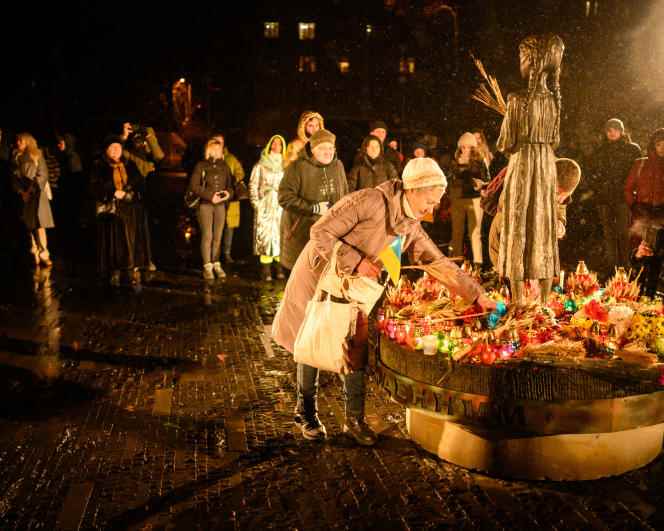 On November 26, 2022, in kyiv, people lay flowers during a ceremony at the monument to the victims of the Holodomor, a Ukrainian term meaning 