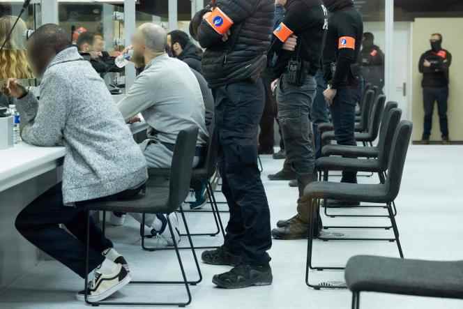 The defendants under police surveillance at the Justitia building in Brussels (Belgium), on December 5, 2022, during the trial of the suicide attacks in the Brussels metro and airport on March 22, 2016.