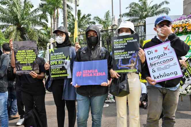 Activists demonstrate against Indonesia's new penal code outside parliament in Jakarta on December 5, 2022.