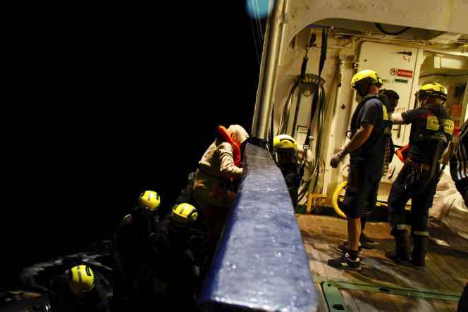 Migrants are rescued by crew members of the humanitarian ships 