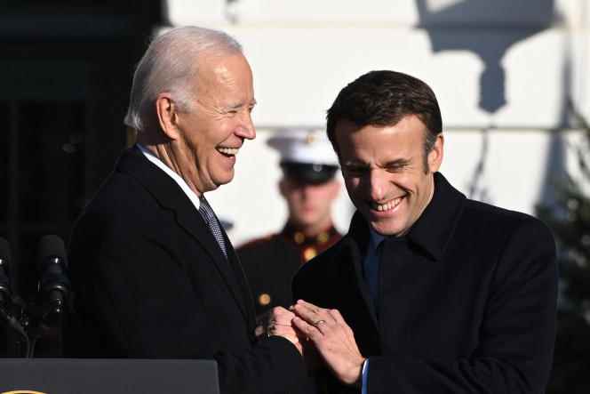 US President Joe Biden and French President Emmanuel Macron shake hands during the state visit welcoming ceremony at the White House in Washington on Thursday, December 1. 