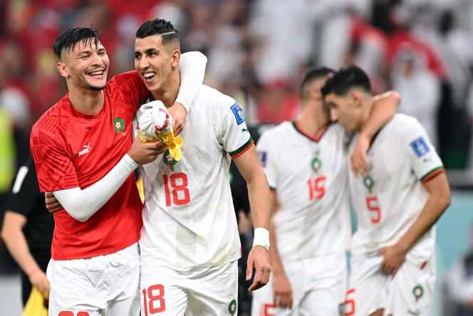 Moroccans Achraf Dari (left) and Jawad El Yamiq celebrated their country's qualification.