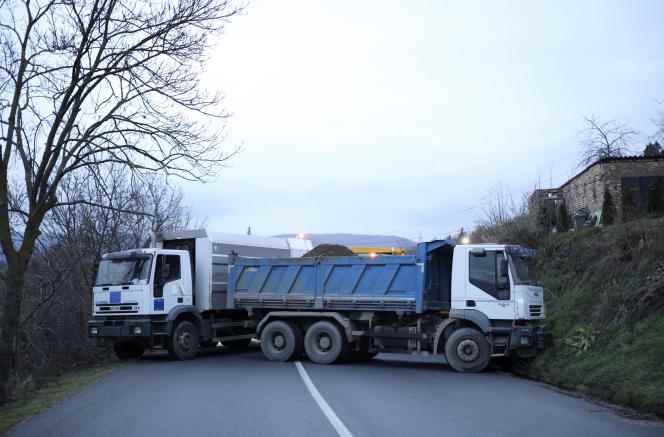 Trucks used to block a road near the village of Rudare, in northern Kosovo, on December 10.