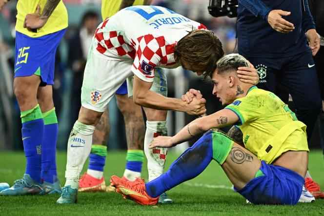 Croatia captain Luka Modric comforts Brazilian striker Antony after Brazil were eliminated in the quarter-finals of the World Cup in Doha on December 9, 2022.