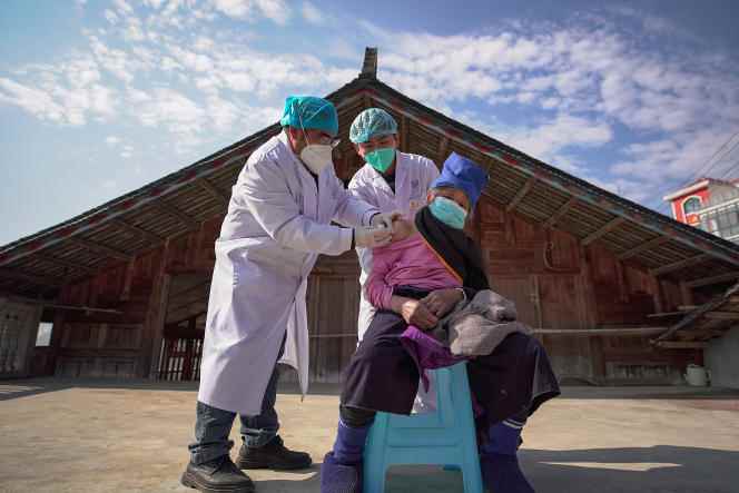 An elderly woman receives a dose of the Covid-19 vaccine in Guizhou province on December 21.