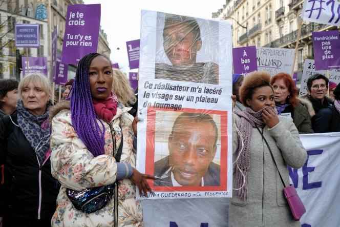 Nadège Beausson-Diagne parades alongside the actress of Azata Soroa and a photo of her attacker, the filmmaker Tahirou Tassere Ouedraogo, during a march at the call of the feminist collective #Noustoutes and many associations in Paris, the November 23, 2019.