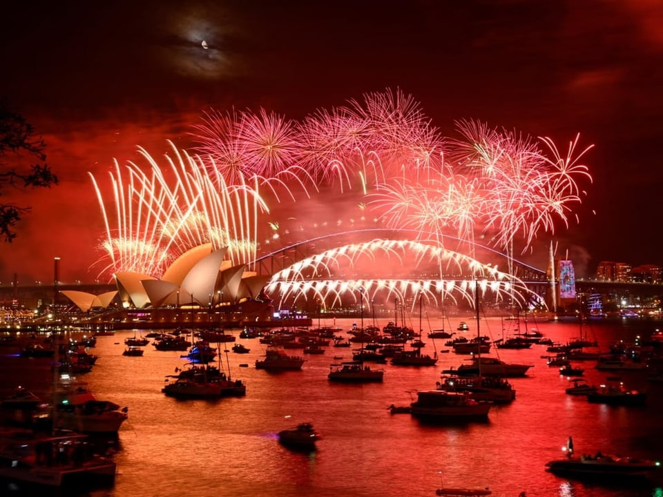 Fireworks in Sydney over the Opera House and Harbor Bridge.