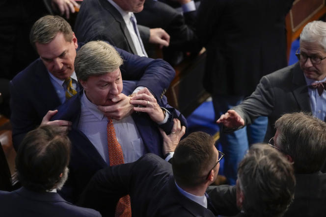 Rep. Mike Rogers is physically restrained by a colleague during a heated argument with Matt Gaetz in the House of Representatives on Jan. 6.