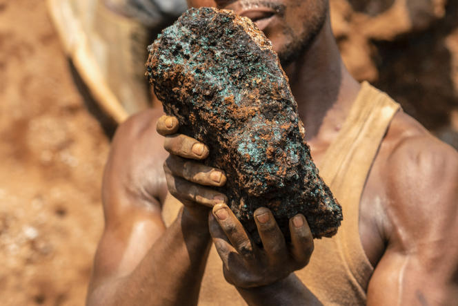 A miner holds a cobalt stone in the Shabara mine near Kolwezi, Democratic Republic of Congo, October 12, 2022.