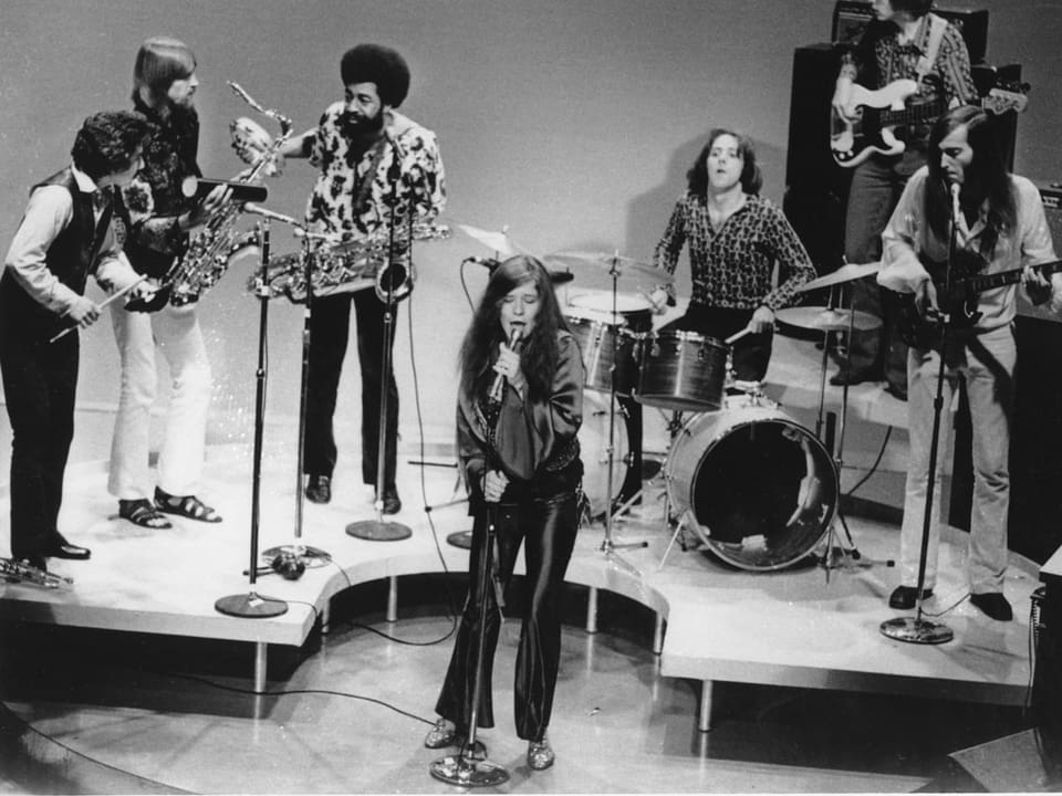 Janis Joplin plays with her band.