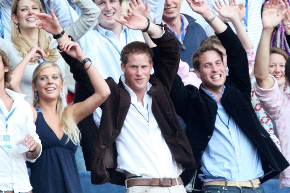 Other times: Chelsy Davy attends a concert in honor of Diana at London's Wembley Arena with Prince Harry and Prince William. 