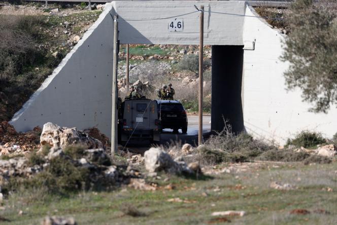 Israeli soldiers stand guard at the scene of a security incident near Ramallah in the occupied West Bank on January 15, 2023.