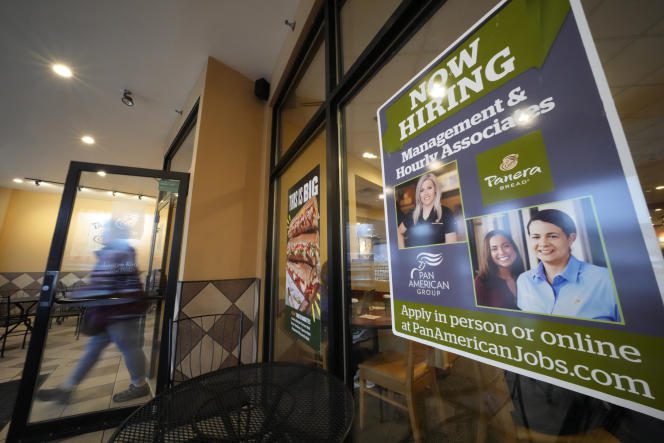 Job vacancies posted in the window of a Panera Bread restaurant in Pittsburgh, United States, January 23, 2023.