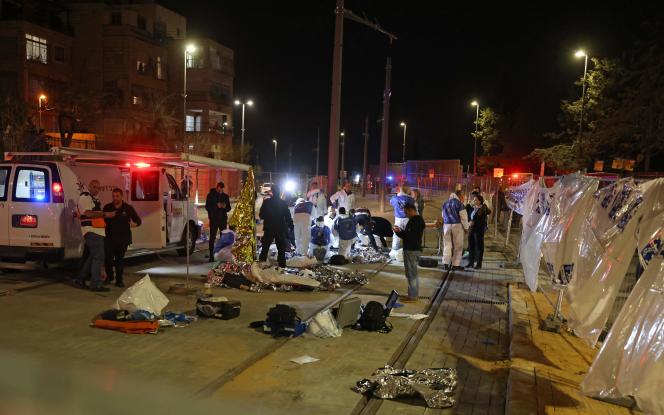 Israeli rescue workers at the site of the shooting, near a synagogue in East Jerusalem, January 27, 2023. 