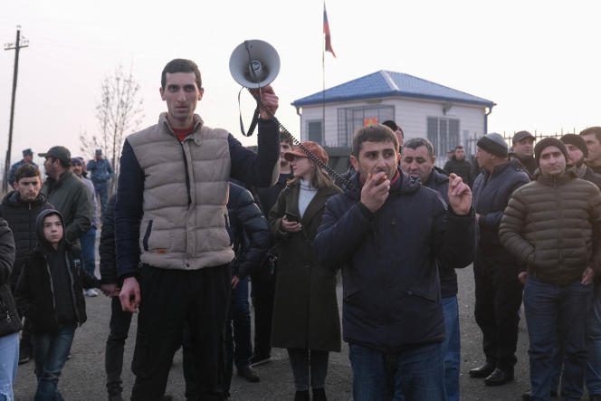 Armenian protesters demonstrate outside a checkpoint near Stepanakert, Nagorno-Karabakh, December 27, 2022.