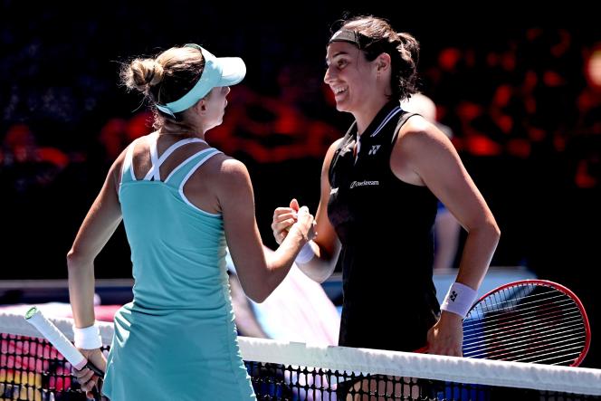 Magda Linette shakes hands with Caroline Garcia (right) after her victory at the Australian Open, in Melbourne, on January 23, 2023.