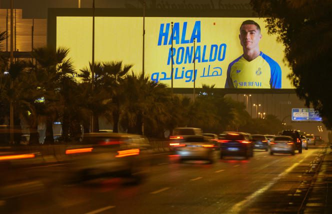 A billboard showing Cristiano Ronaldo with the Arabic inscription 