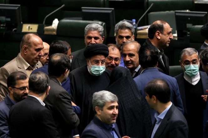 Iranian President Ebrahim Raisi arrives at parliament to present his finance bill in Tehran on January 22, 2023.