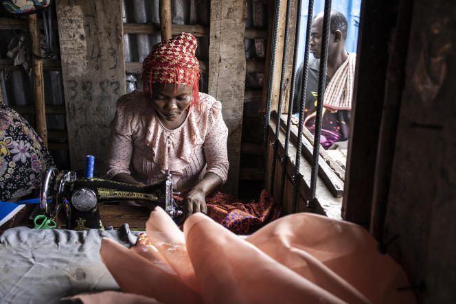 A seamstress in Freetown, April 2022.