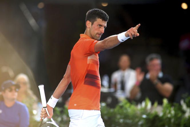 Novak Djokovic asks his brother to leave the stands after losing the first set, during the final of the tournament in Adelaide, Australia, Sunday January 8, 2023. 