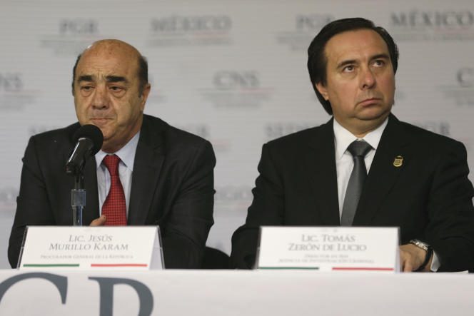 Mexico's former attorney general Jesus Murillo Karam (left) stands with Tomas Zeron, former director of Mexico's Criminal Investigation Agency, in Mexico City on October 9, 2014.
