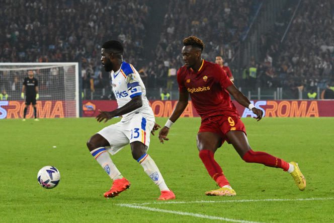 Lecce's French defender Samuel Umtiti (left) and AS Roma's British striker Tammy Abraham, during the Italian Serie A soccer match between AS Roma and Lecce at the Olympic stadium in Rome on October 9 2022. 