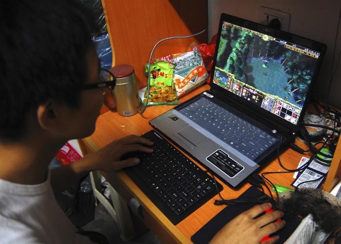 A Chinese student playing the massively multiplayer role-playing game 