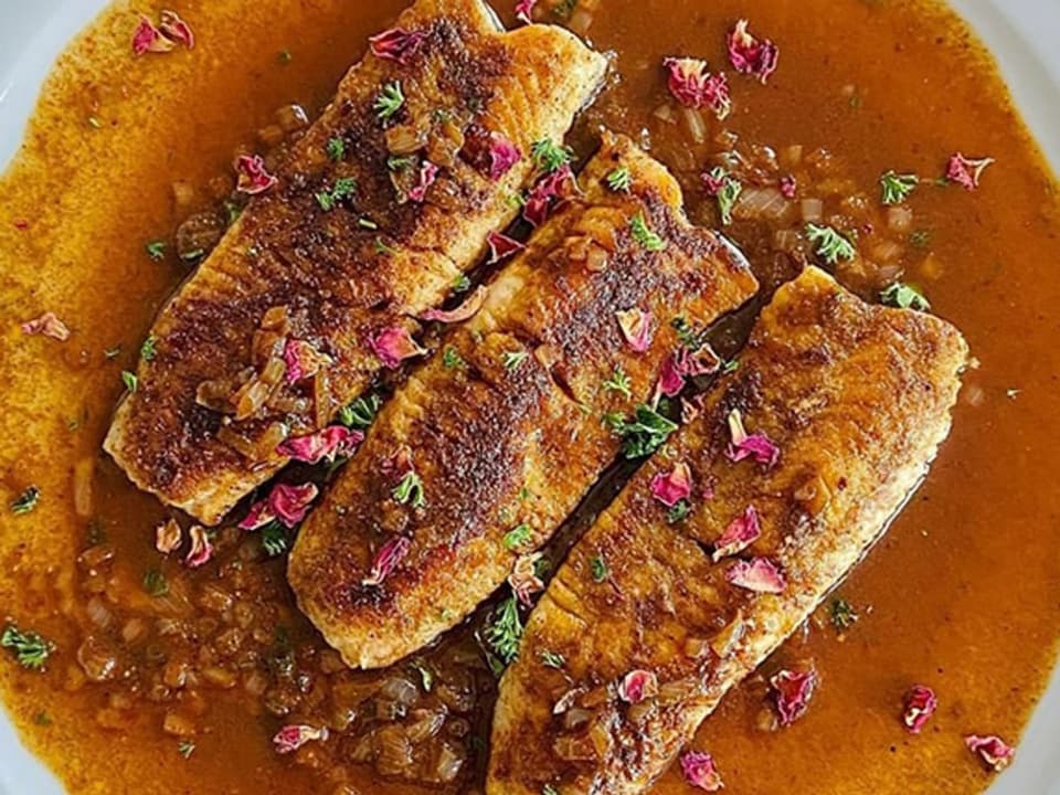 Trout fillets seasoned with baharat.
