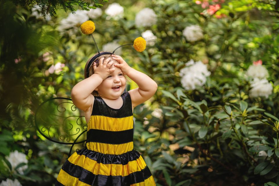 Childhood heroes: child in bee costume