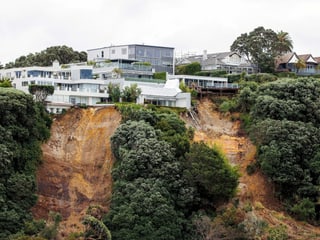 A landslide right next to a modern development.