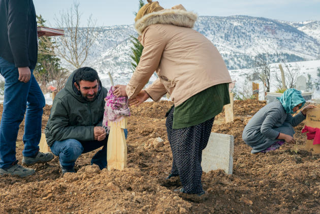 Scarves on graves are used to identify women or girls at the cemetery in Büyüknacar (Turkey), February 19, 2023. 