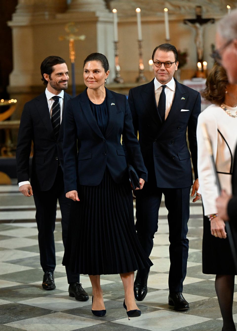 Crown Princess Victoria, Prince Daniel and Prince Carl Philip pray for peace in Stockholm.