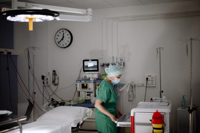 Dr. B., 39, Algerian obstetrician gynecologist and intern associated with the Soissons hospital center, checks the equipment before an intervention in the operating room, April 5, 2022. 