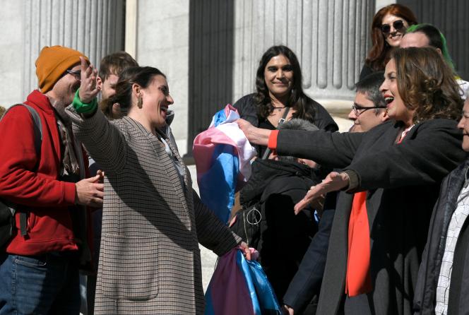 In Madrid on February 16, 2023, Spanish Minister for Equality Irene Montero, left, celebrates with activist and first transsexual elected to the Spanish Parliament Carla Antonelli, right, in front of the Spanish Congress, the vote of the law “ transgender”. 