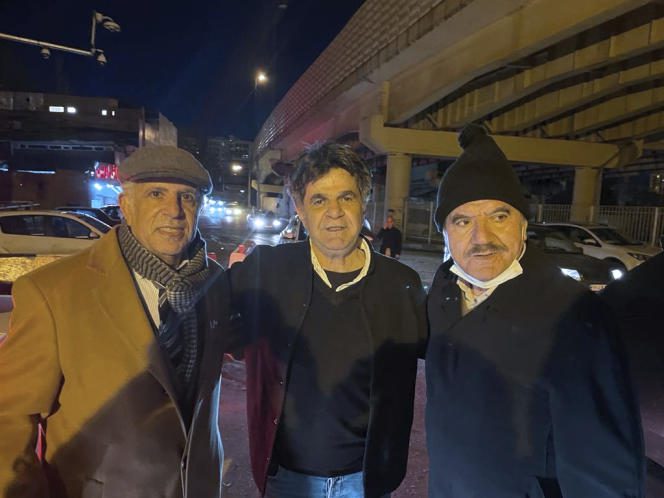 A photo provided by the family of Jafar Panahi showing the Iranian filmmaker (in the center), on his release from prison in Tehran, on February 3, 2023, surrounded by his lawyers, Yusef Moulai (on the left) and Saleh Nikbakht.