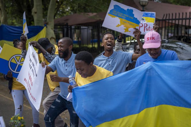South Africans join Ukrainians in a protest outside the Russian Embassy in Pretoria, South Africa, February 22, 2023.