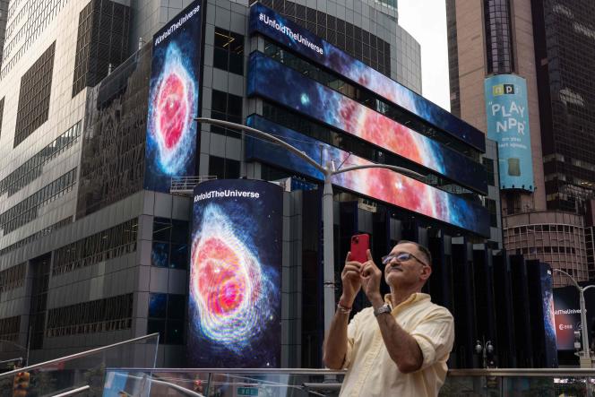 Images captured by the James-Webb Space Telescope are displayed on screens in Times Square, New York, July 12, 2022.